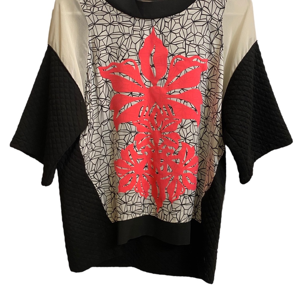 Space style concept top. Round neck. Flower motif.